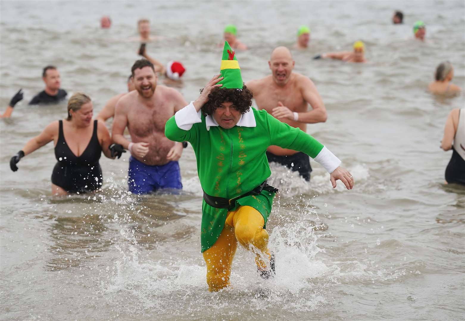 Hundreds of people took part in the annual New Year’s Day charity swim on Bray seafront in Co Wicklow (Brian Lawless/PA)