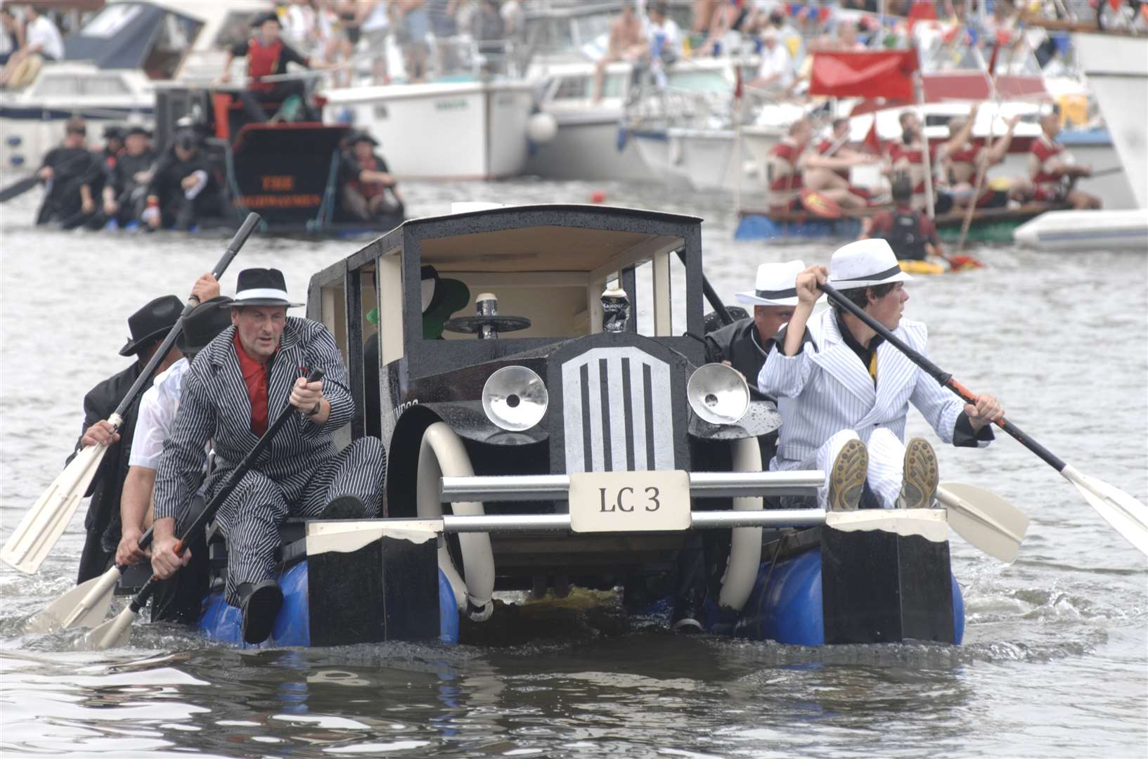 The Guinness Gangsters row their way to the finish line at a previous race. Photo: Matthew Walker