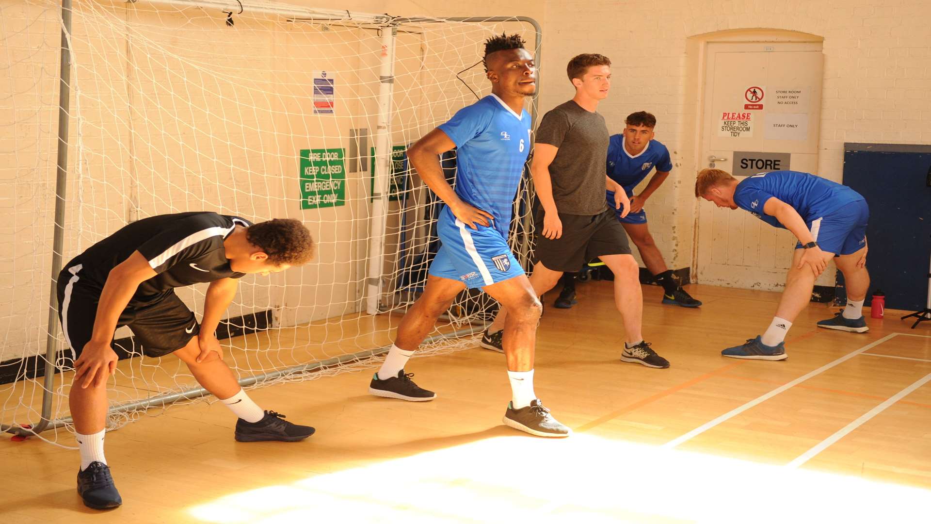 Gillingham players warming up ahead of their fitness tests