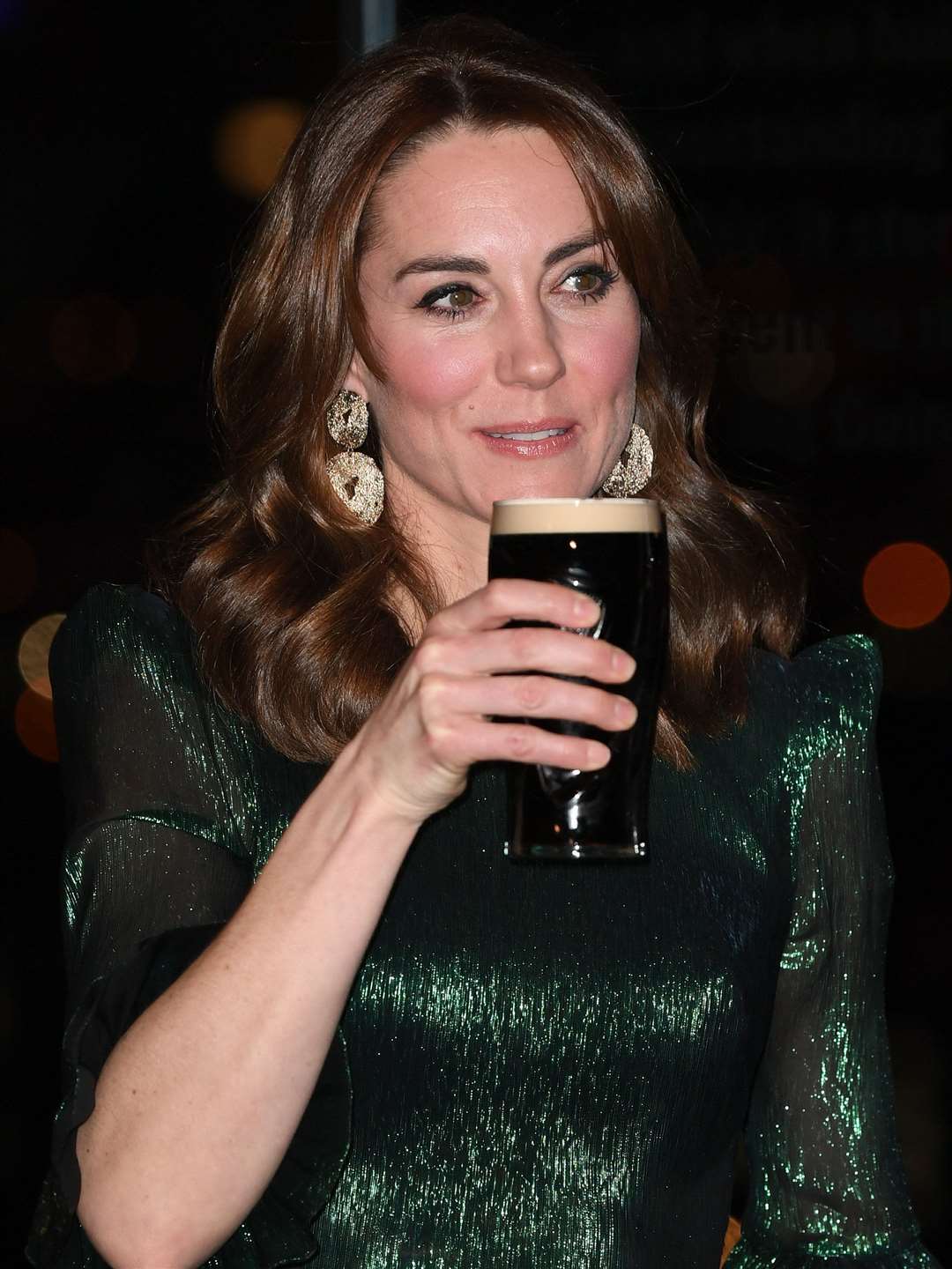 The Duchess of Cambridge holds a pint of Guinness during a reception hosted by the British ambassador in Dublin in March (James Watling/PA)