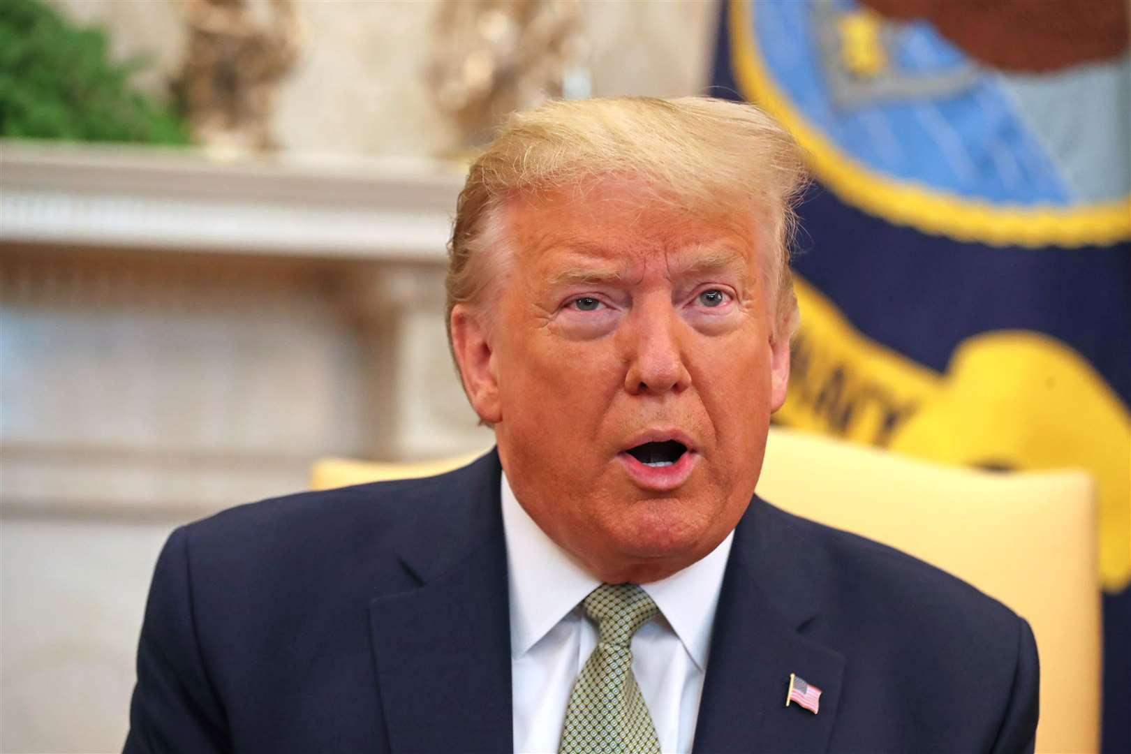 US President Donald Trump in the Oval Office during his previous term as president. (PA)