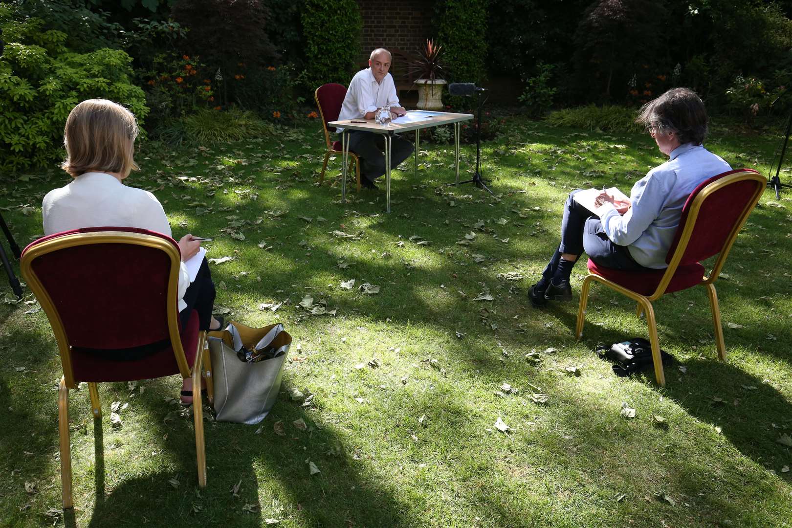 Journalists sit at distance while listening to Dominic Cummings (Jonathan Brady/PA)