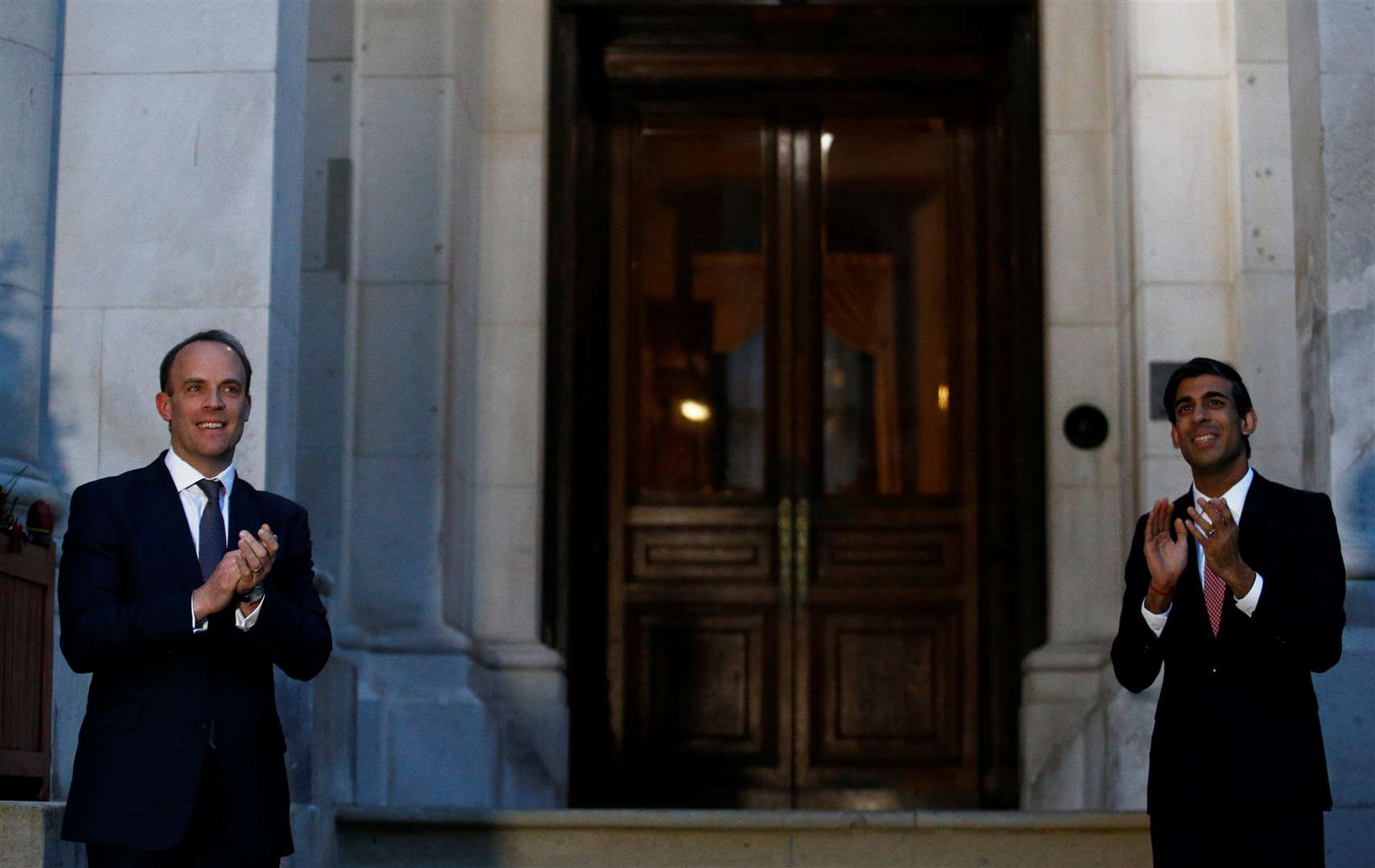 Foreign Secretary Dominic Raab, left, and Chancellor Rishi Sunak took part outside the Foreign and Commonwealth Office (Henry Nicholls/PA)