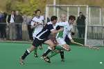 A Canterbury player (green/white) goes on the attack against Bromley & Beckenham