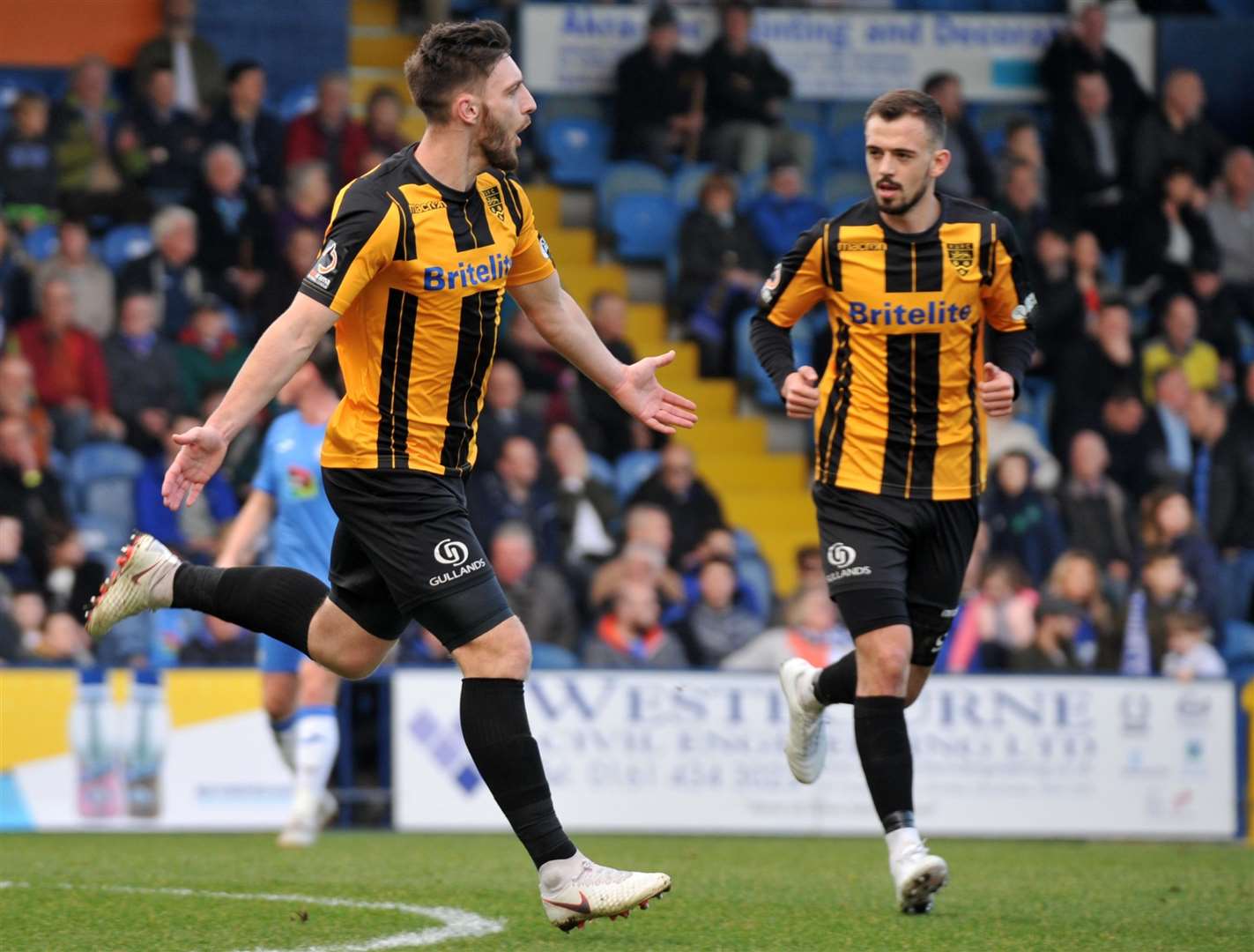 Jake Cassidy celebrates giving Maidstone the lead at Stockport Picture: Steve Terrell (7397946)
