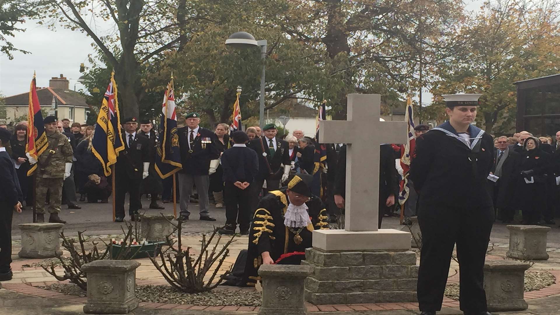Mayor of Deal Adrian Friend places a wreath down