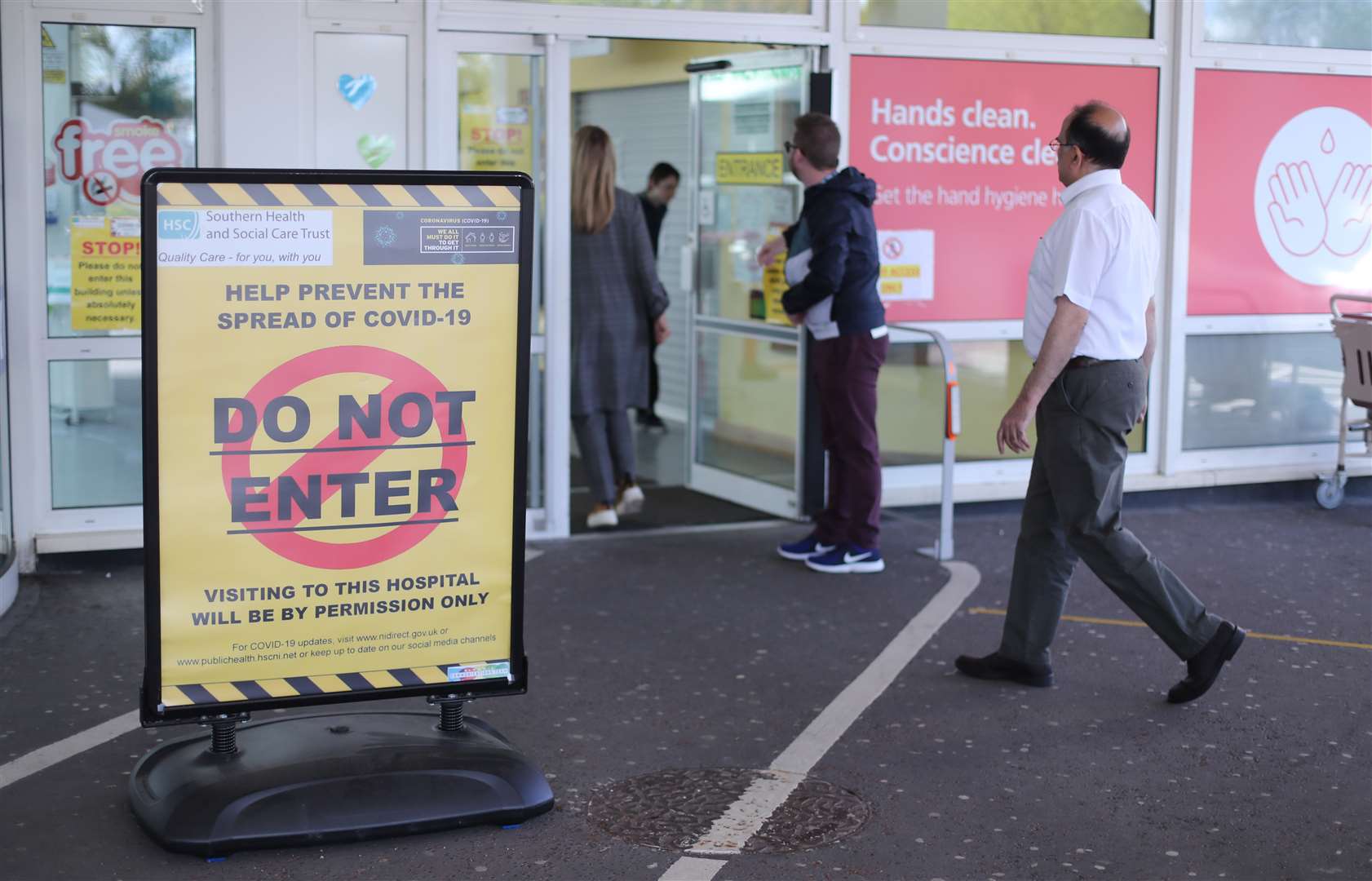 A general view of Covid-19 signage at the entrance to Craigavon Area Hospital (Niall Carson/PA)