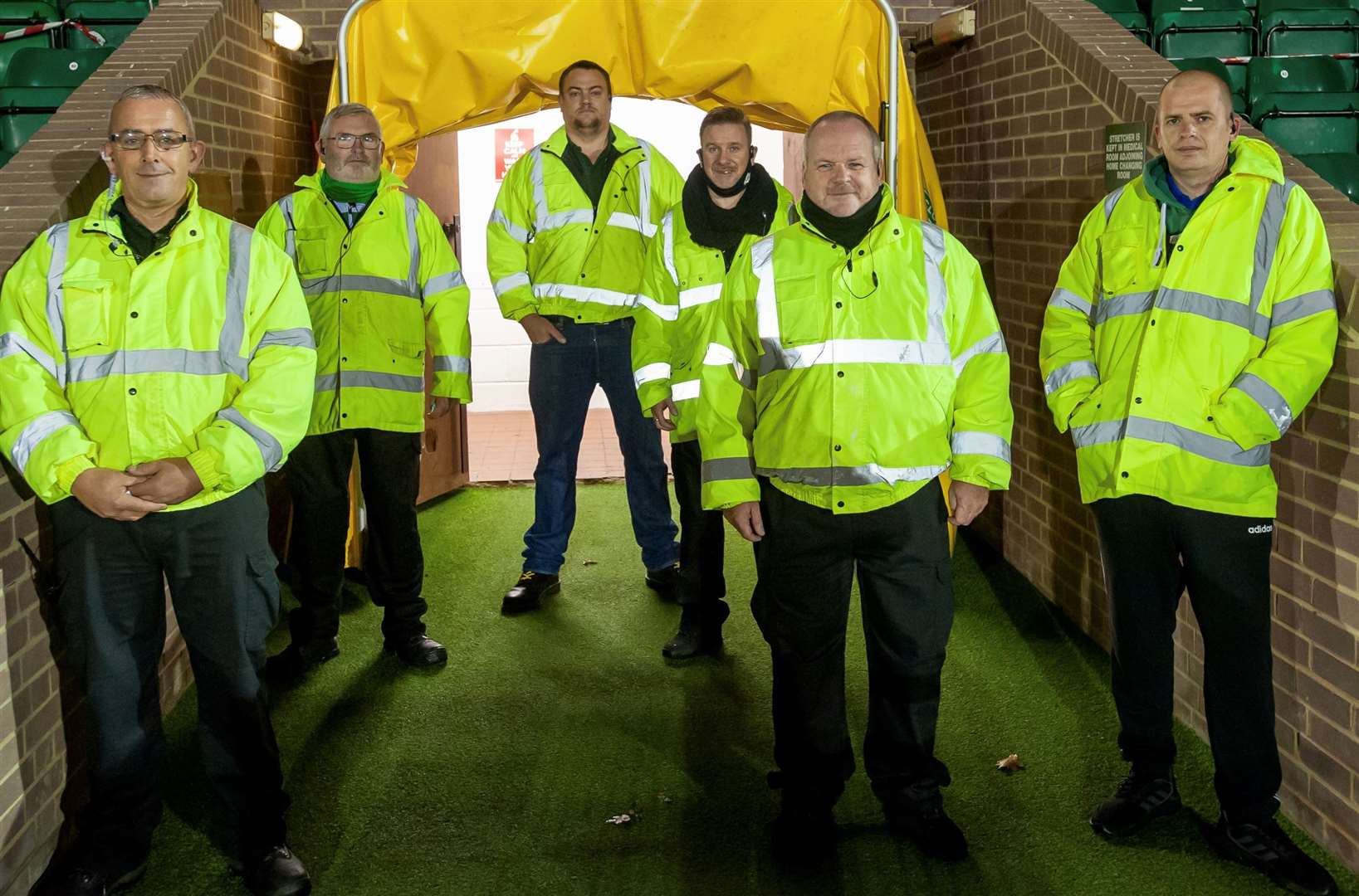 Ashford United have paid tribute to beloved steward Mark Reed (second right) after he died following a brief illness. Picture: Ashford United