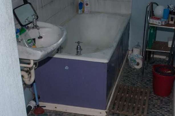 The bathroom where Danny Wallis's body was found