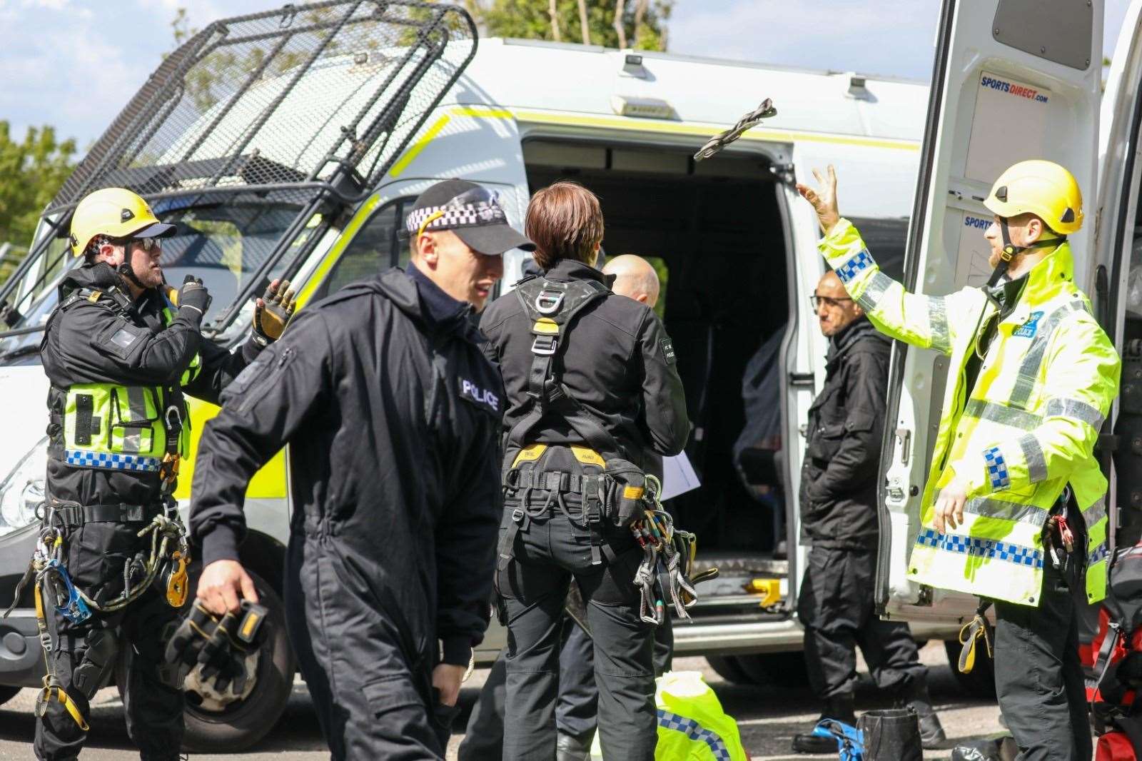 Police in harnesses prepare to repel on to track Picture: UKNIP