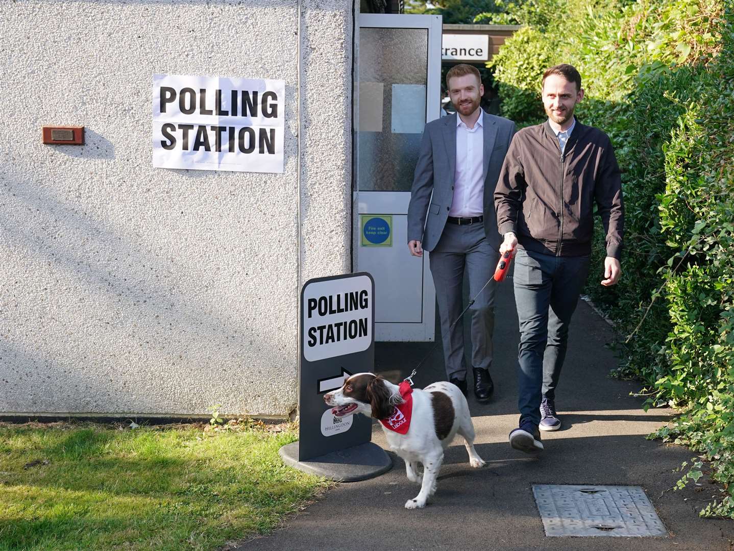 Danny Beales, Labour candidate for Uxbridge and South Ruislip (left) with his housemate Joel Kenyon and dog Buddy leave after casting their votes (Jonathan Brady/PA)