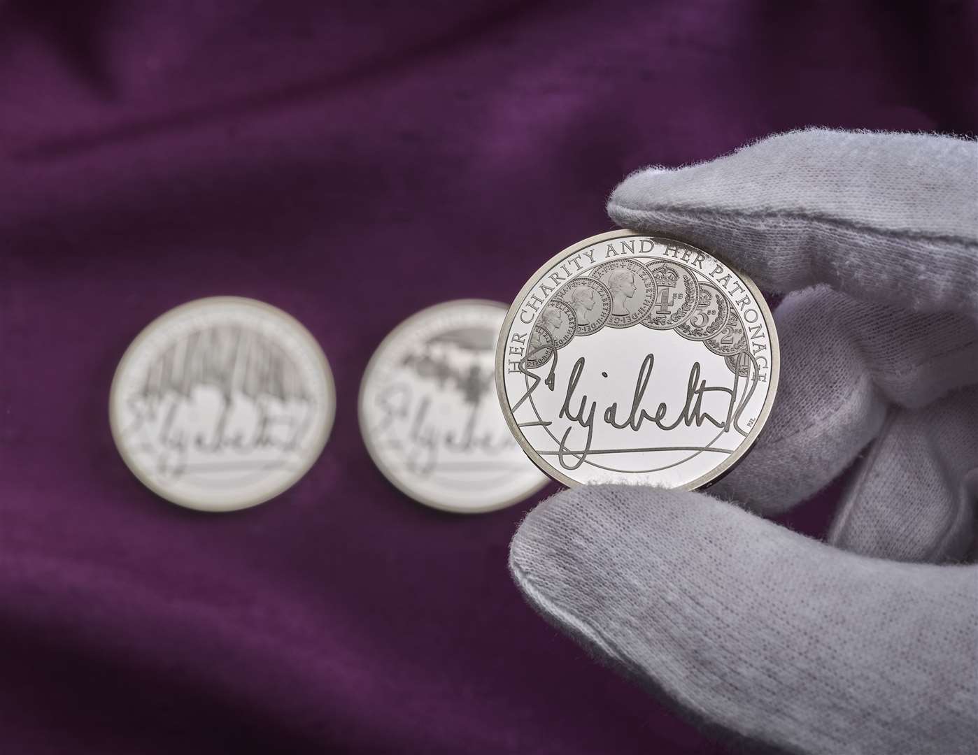 All three coins in the Royal Mint’s new collection feature the Queen’s signature (Royal Mint/PA)