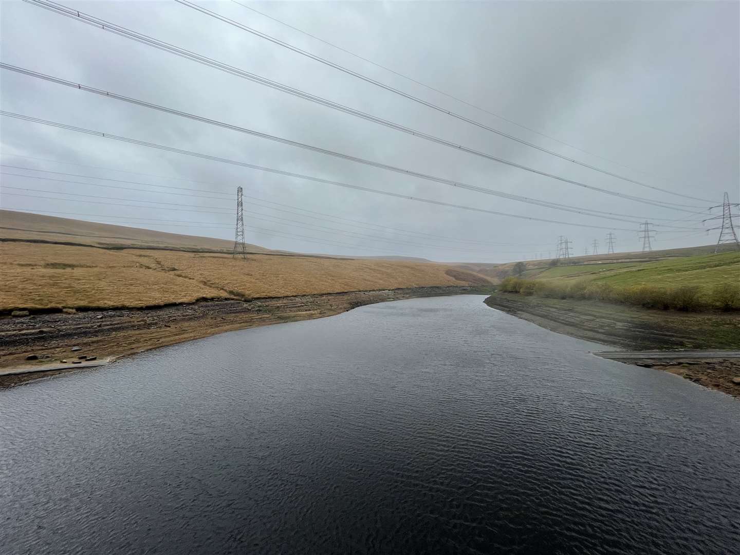 Baitings Reservoir, near Ripponden, West Yorkshire, where the bridge exposed in the summer drought (top) has now re-submerged (Dave Higgens/PA)