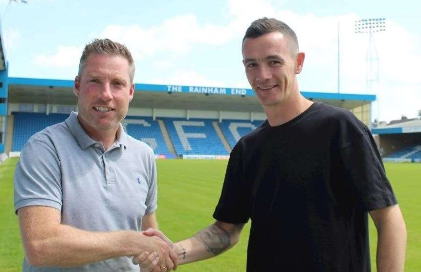 Gills boss Neil Harris with midfielder Shaun Williams. Picture: GFC