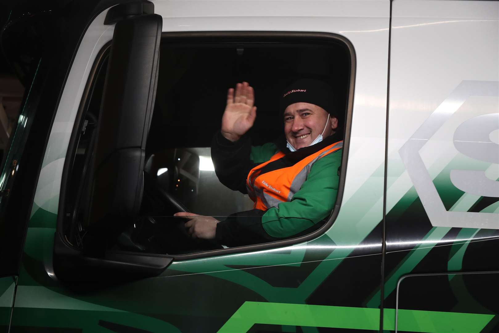 The first lorry, driven by Slavi Ivanov Shumeykov, loads on to Le Shuttle at the Eurotunnel in Folkestone, Kent, after the UK left the single market and customs union (Gareth Fuller/PA)