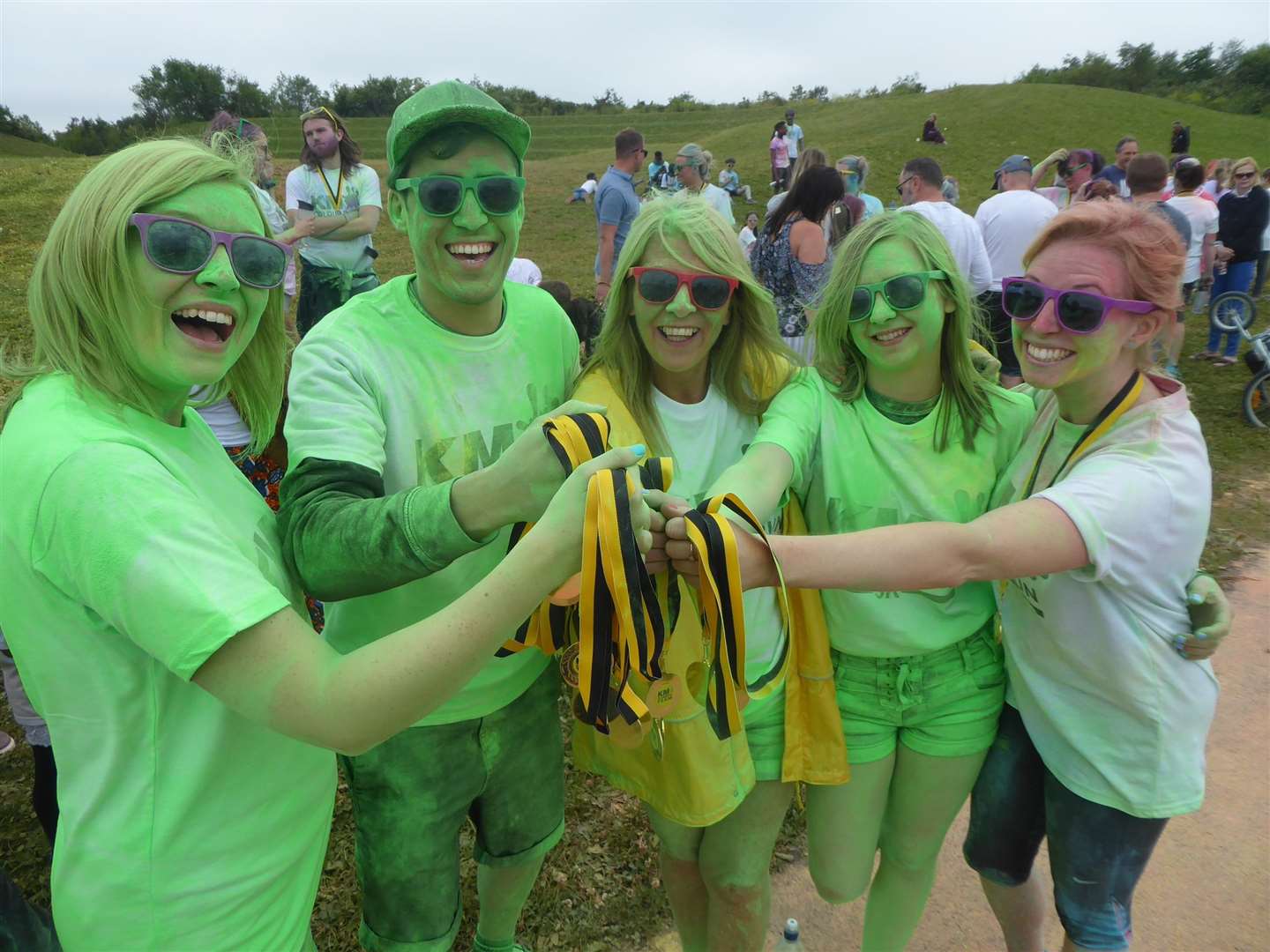 Canterbury Specsavers staff volunteered to give out KM Colour Run medals at the finish line. (2471164)