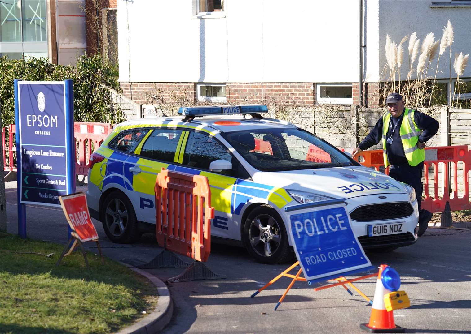 Police outside Epsom College in Surrey after the deaths (PA)