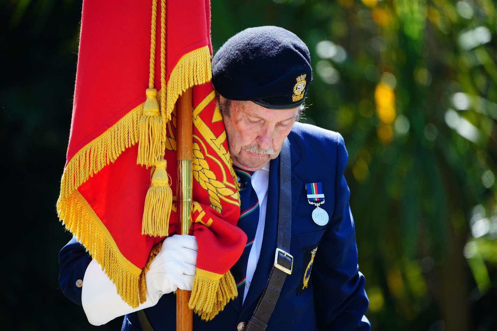 A veteran during a wreath-laying ceremony in Kimberley Park, Falmouth, ahead of an 80-strong boat flotilla, one for each year since the D-Day landings, sailing off the coast of Falmouth (Ben Birchall/PA)