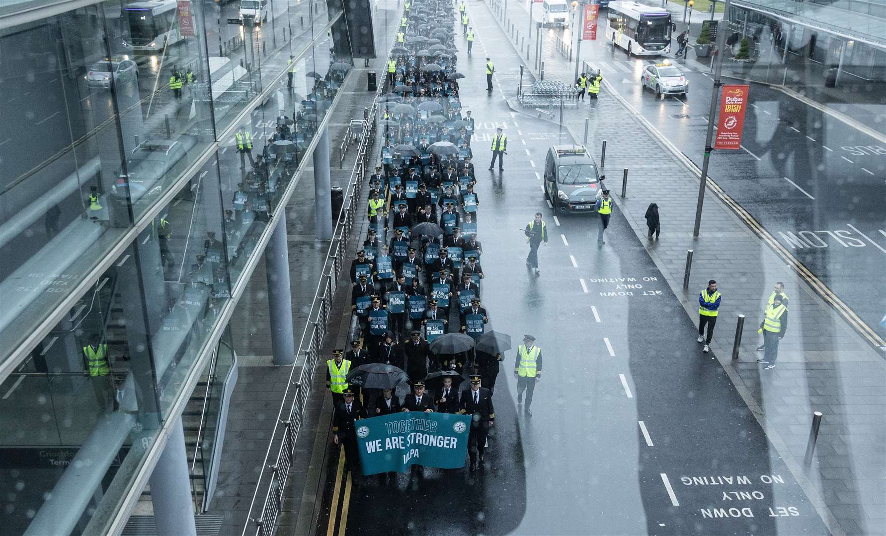 Striking Aer Lingus pilots march around Dublin Airport on June 29 (Evan Treacy/PA)