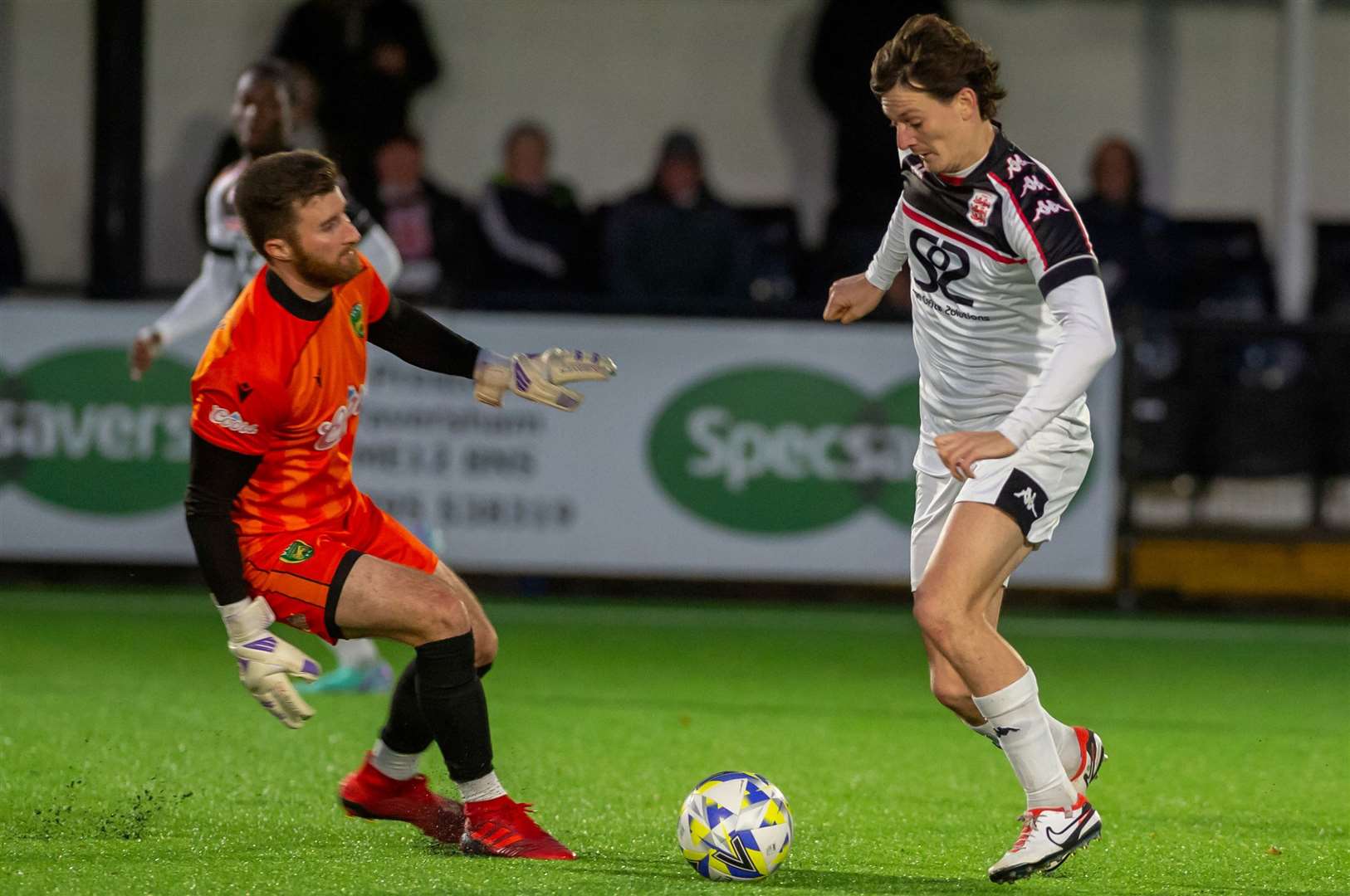 Billy Bennett of Faversham up against VCD goalkeeper Joe Hyde. Picture: Ian Scammell