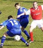 Andy Hessenthaler, centre, and team-mate Mark Saunders in first half action against Rotherham on Saturday. Picture: PAUL DENNIS