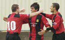 Sittingbourne goalscorer Laurence Harvey, centre, is congraualted by Ryan Golding, left, and Hicham Akhazzan