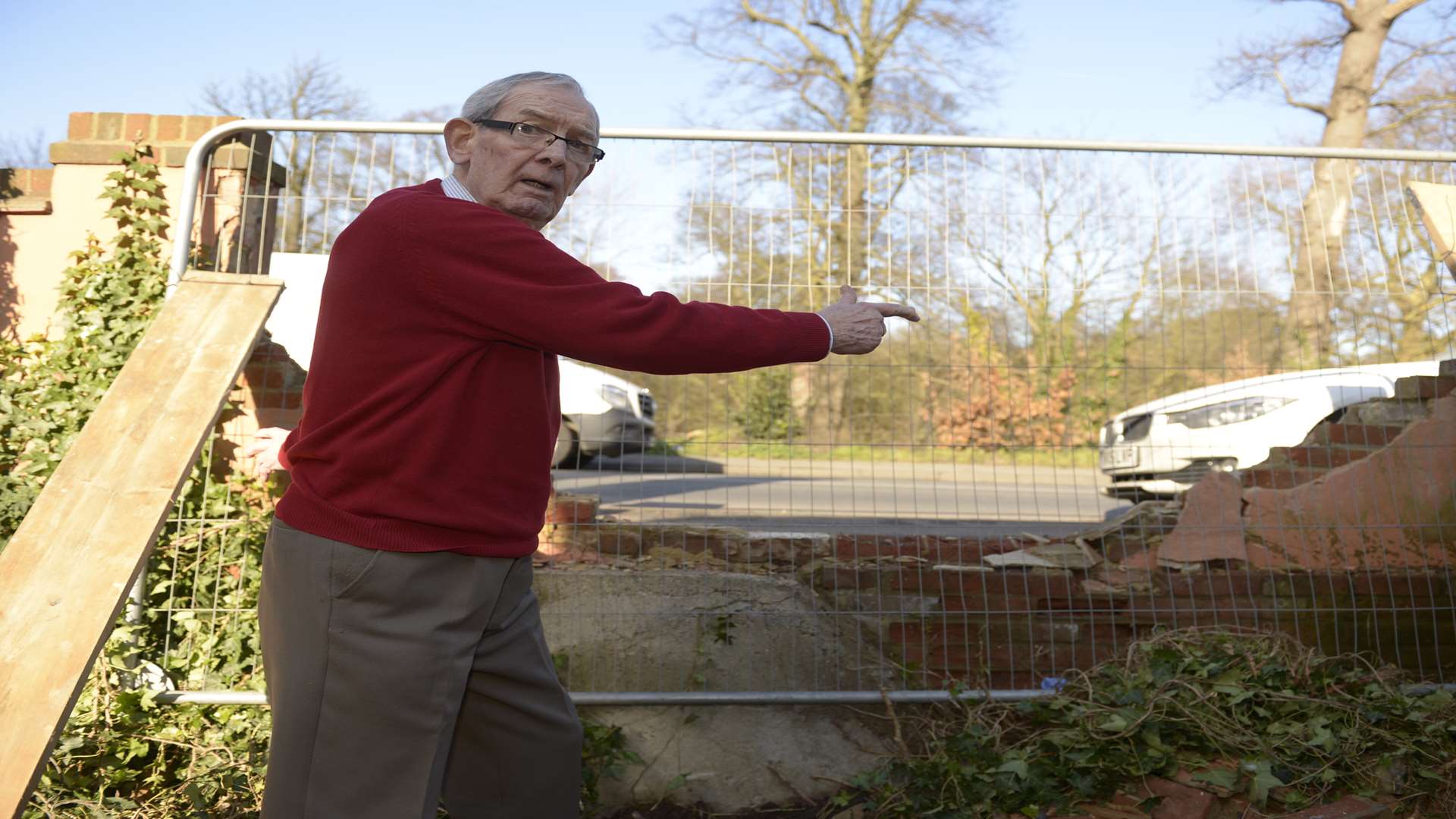 Peter Webb looks at the damage caused to his wall