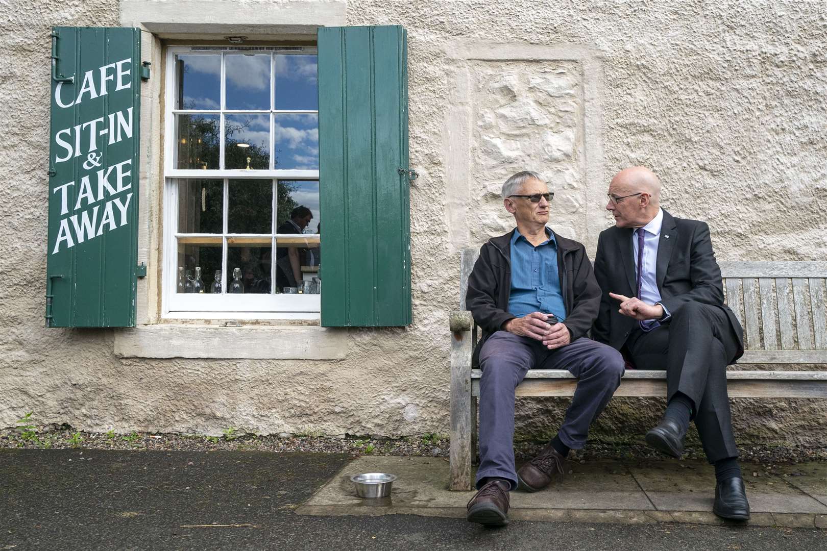 Mr Swinney uses his persuasive powers with a voter (Jane Barlow/PA)