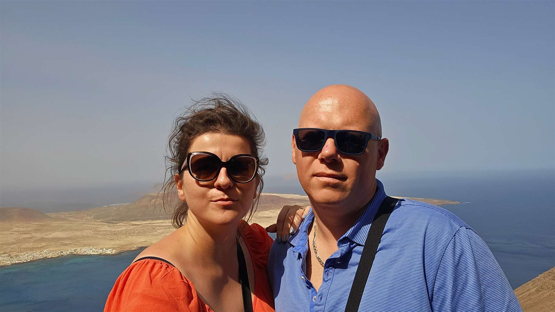 Izabela and her husband Dawid in Lanzarote before the fire at Luton airport (Izabela/PA)