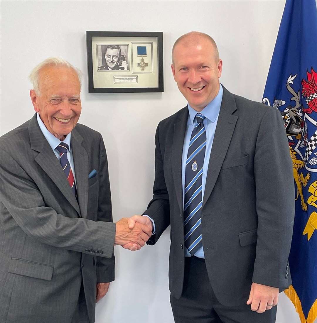 Former association national secretary Ron West, left, and Police Superintendents' Association president Paul Griffiths at the memorial for Chief Superintendent Gerald Richardson this Monday. A framed photo has been unveiled in Supt Richardson's memory at the headquarters in Pangbourne, Berkshire. Picture: Police Superintendents' Association