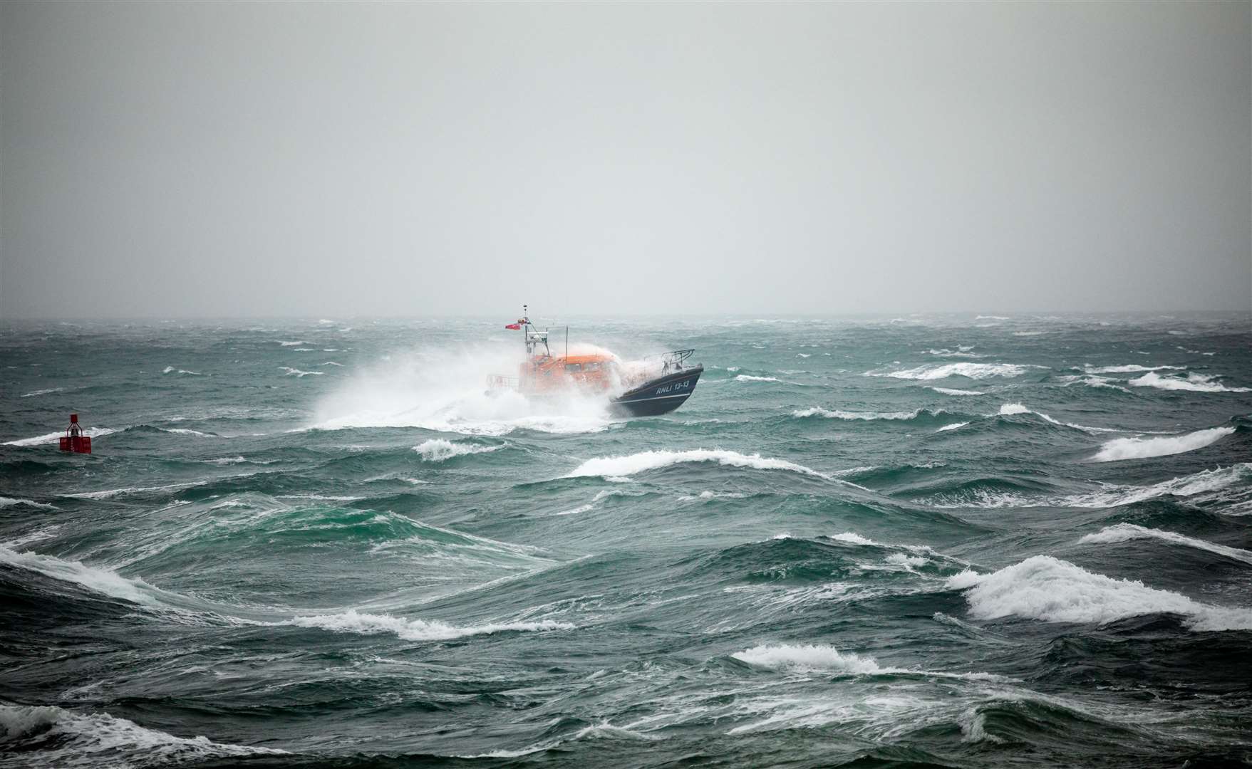 A Shannon class lifeboat from RNLI Swanage Lifeboat Station at sea during a training exercise in rough weather (Nathan Williams/RNLI)