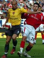 Freddie Ljunberg holds off Charlton's Bryan Hughes. Picture: MATTHEW WALKER