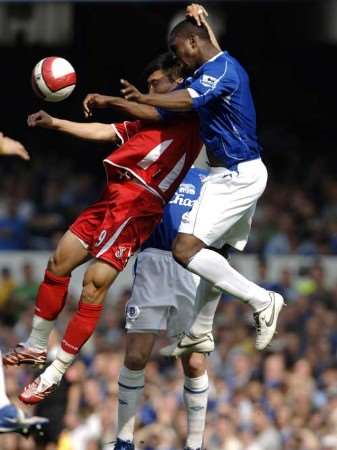 Charlton's Zheng Zhi is beaten in the air by Joseph Yobo. Picture: MATT WALKER