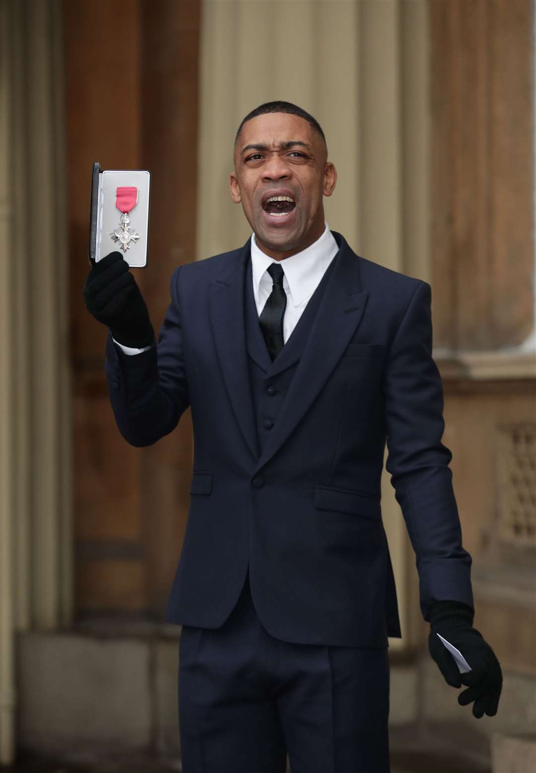 Wiley holding his MBE following an investiture ceremony at Buckingham Palace in 2018 (Yui Mok/PA).