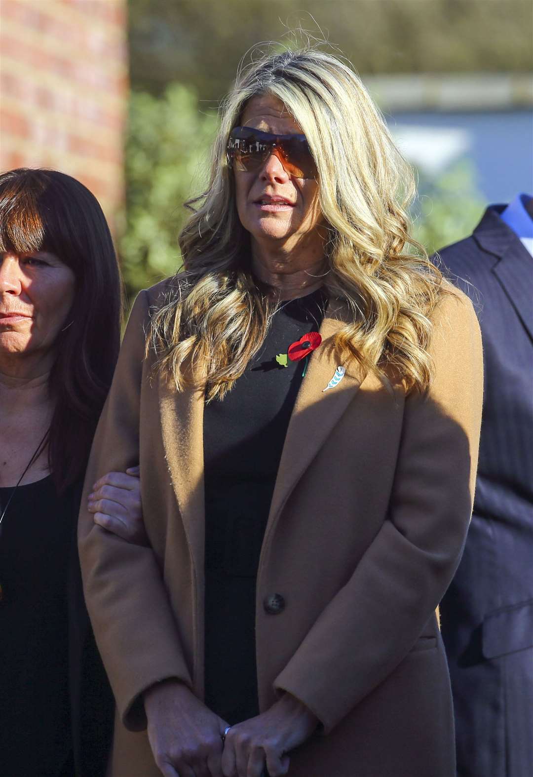 Su Bushby watches as the hearse departs (Gareth Fuller/PA)