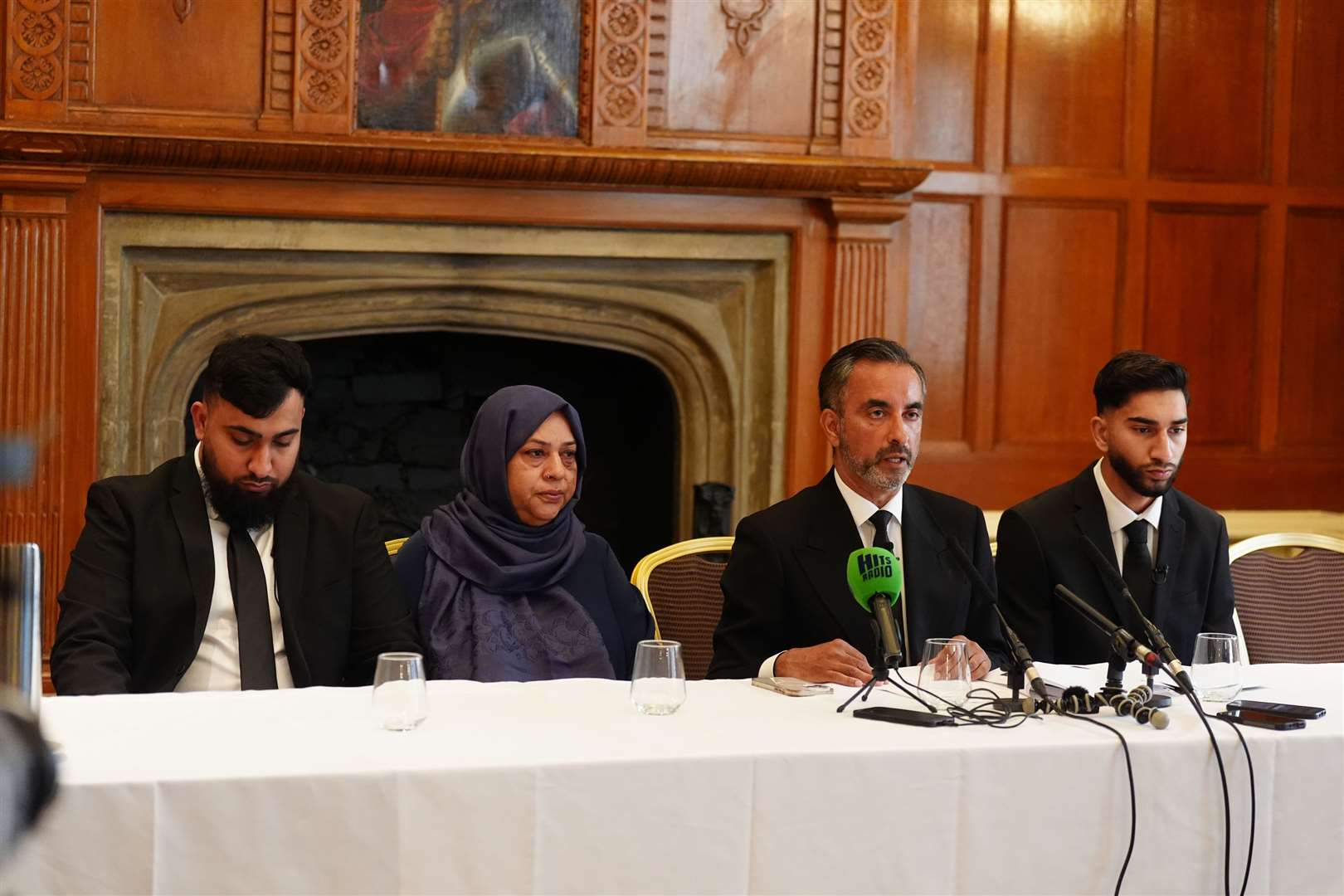 Solictor Aamer Anwar (second right) with brothers, Muhammad Amaad, 25, (left) Fahir Amaaz, 19, and their mother Shameem Akhtar, 56, during a press conference at the Midland Hotel in Manchester (Owen Humphreys/PA)