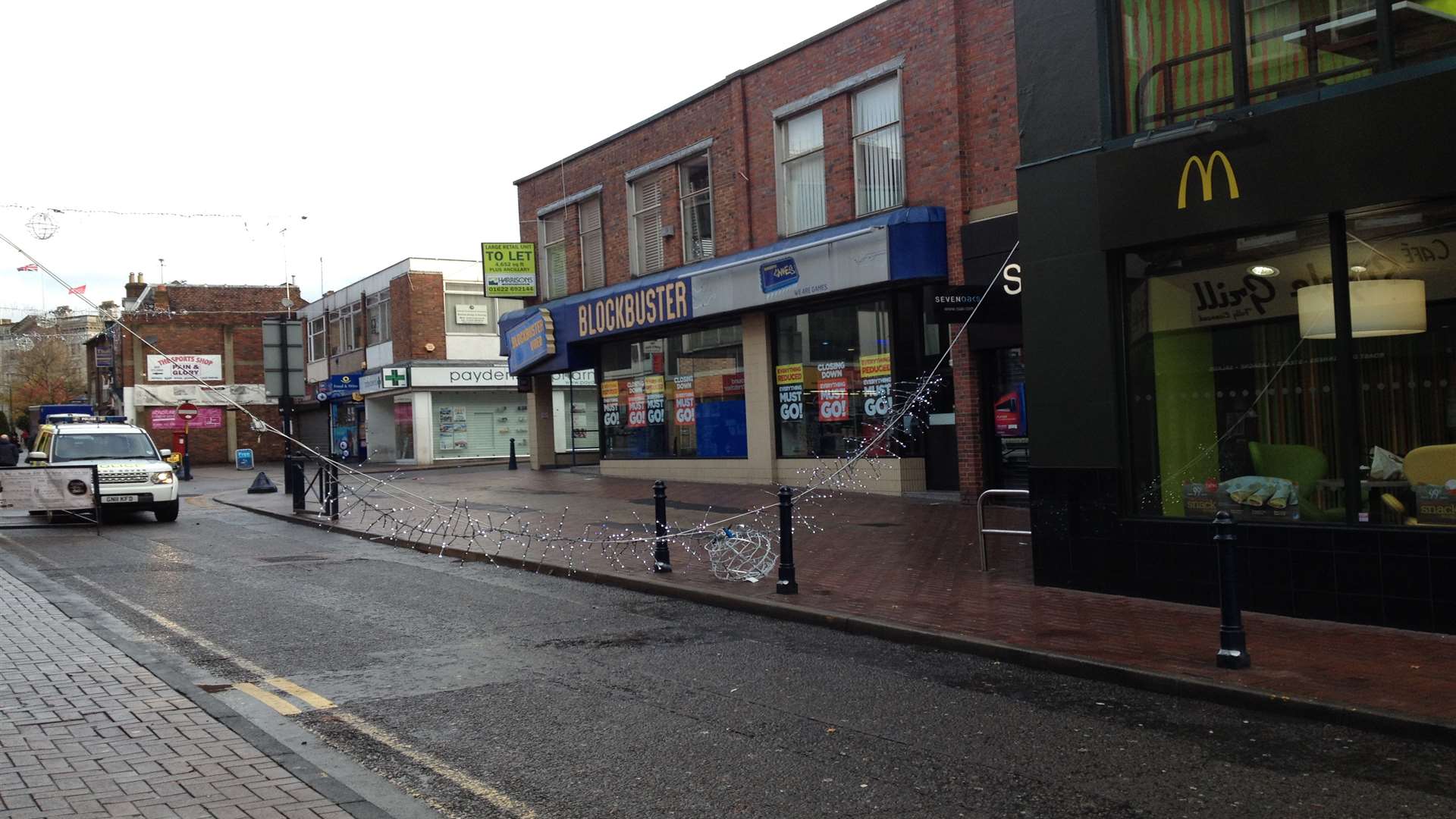 The lights were left hanging across the road in Week Street