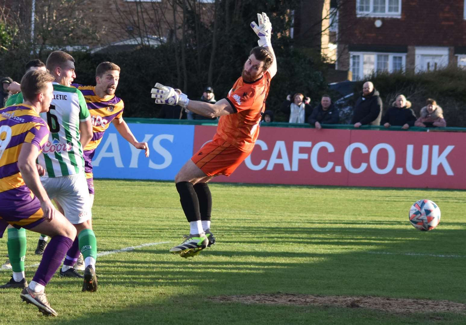 Billy Munday heads in the opening goal for Deal, beating VCD goalkeeper Joe Hyde in the Hoops’ weekend 3-0 win. Picture: Alan Coomes