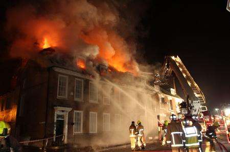 Fire crews battle a blaze in West Malling High Street on January 11, 2013. Picture: Jeffrey Hurst