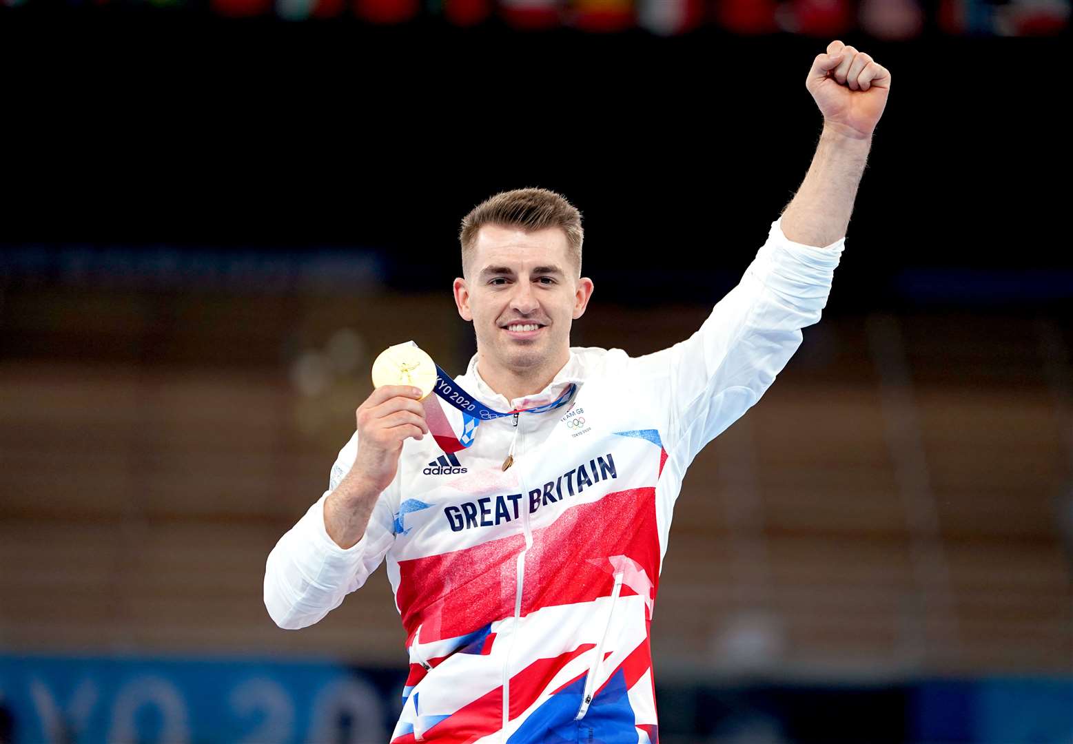 Max Whitlock celebrates with his gold medal after winning the men’s pommel horse final (Mike Egerton/PA)