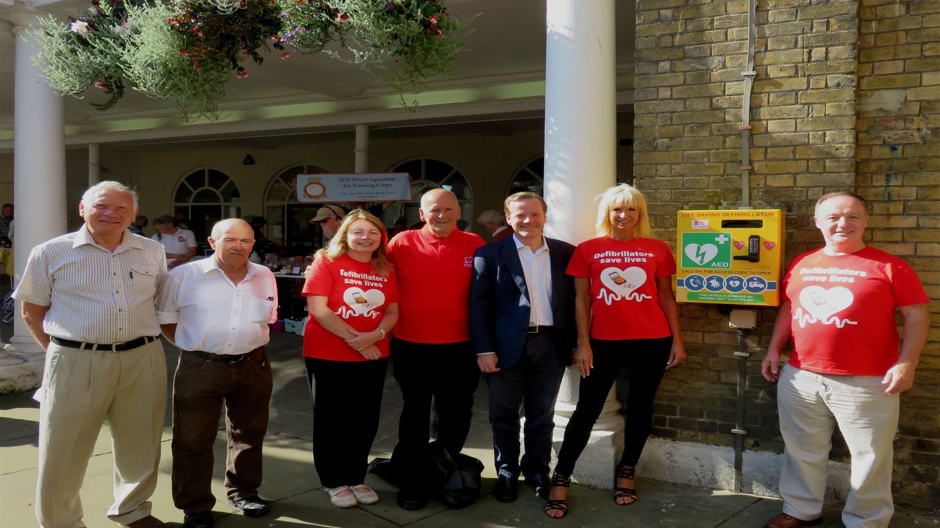 Chaplain Paul Fermor, Cllr Wayne Elliot, Angela Hopkins, Cllr Adrian Friend, MP Charlie Elphicke, Beverley-Jayne Last and Ken Hopkins with the new defibrillator at Deal Town Hall