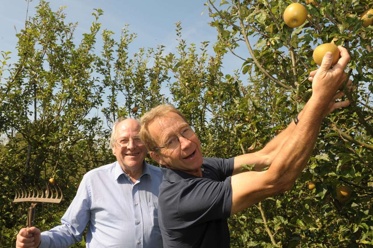 Cllr Vaughan Hewett and Hamish Mackay Miller in the orchard