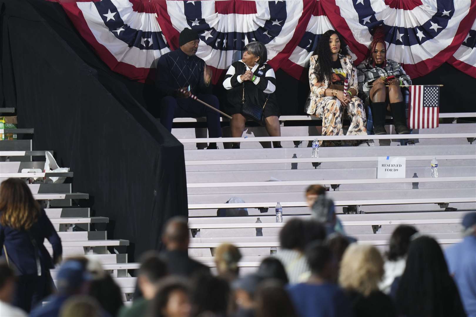 Supporters sit as people leave an election night campaign watch party for Vice President Kamala Harris after it was announced that she would not speak on Wednesday, on the campus of Howard University in Washington (Stephanie Scarbrough/AP)