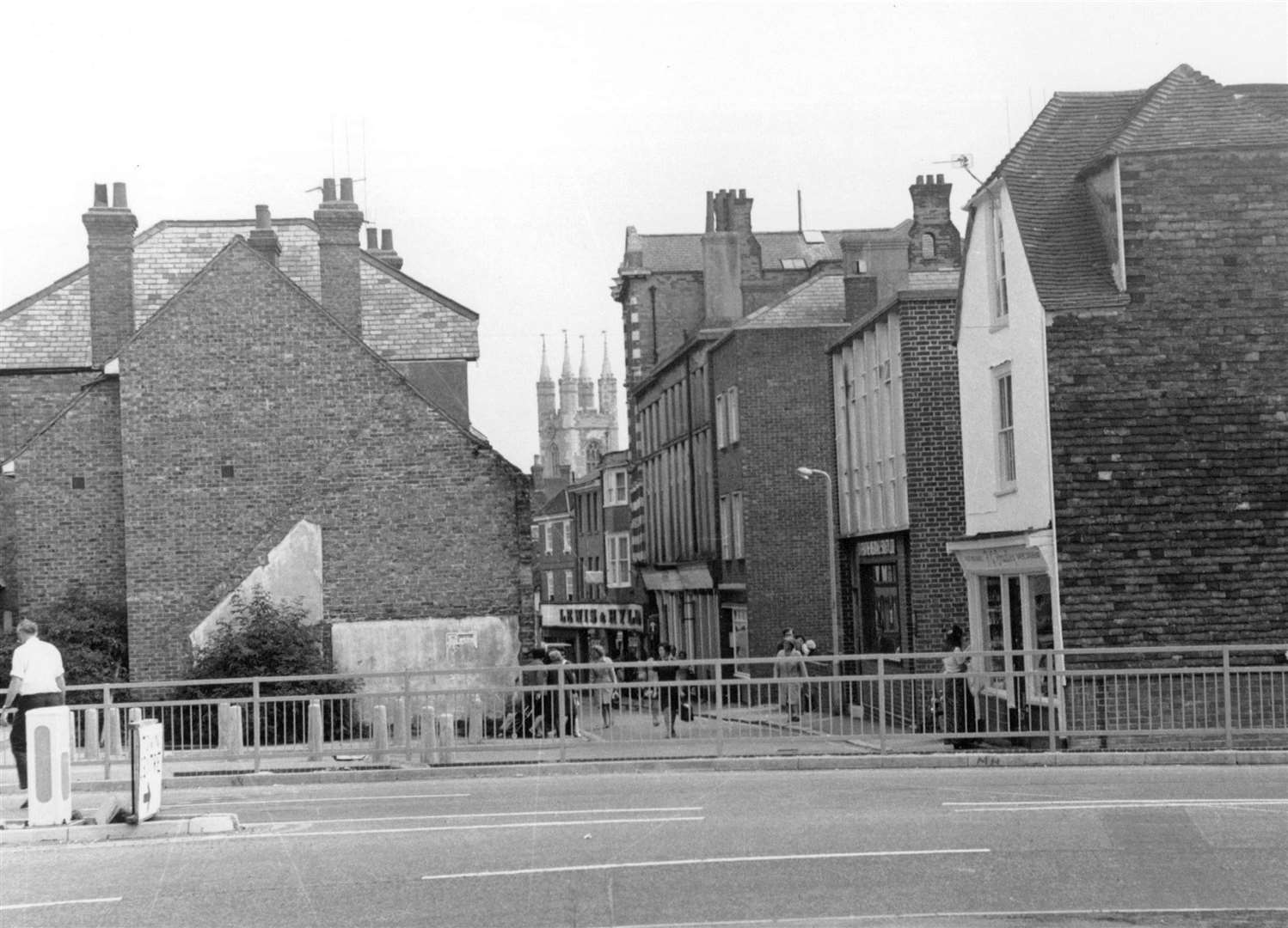 New Rents, 1975. Once crossing Forge Lane from New Street, this was the view back in the early 1970s in the days before Safeway purchased the Gravel Walk car park for their new supermarket which latterly became Lidl. Again, Lewis and Hyland can clearly be seen below the church tower of St Mary the Virgin which shops including F.G Bradley; Bakers sundriesman can be seen on the right. Picture: Steve Salter