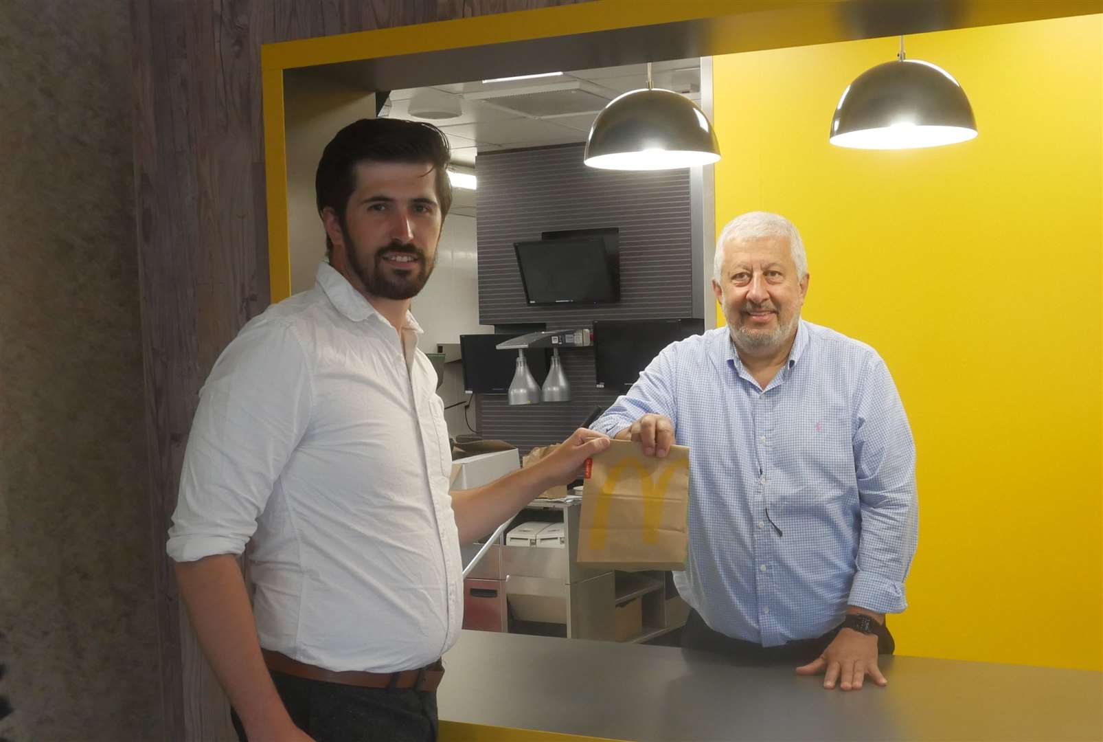 Reporter Ben Austin receiving his food from franchisee Ali El-Hajj at the new counter