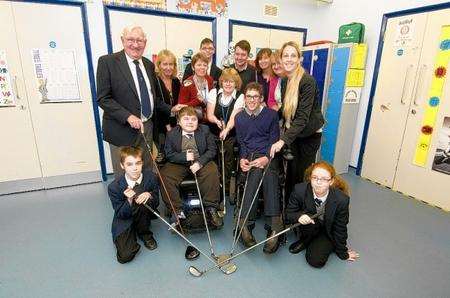 Representatives from the Society of Kent Golf Captains with staff and children