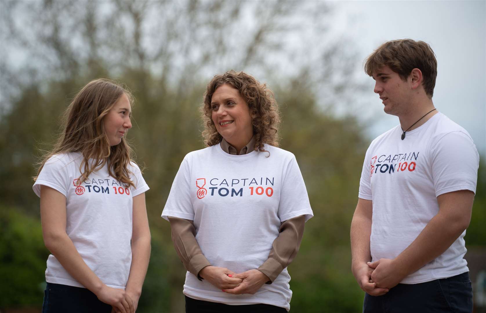 Captain Sir Tom Moore’s daughter Hannah Ingram-Moore (centre) and his grandchildren Georgia and Benjie (Joe Gidens/PA)