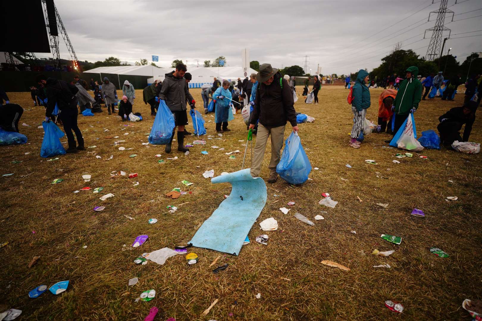 It’s all hands on deck to clear the vast amounts of rubbish (Ben Birchall/PA)