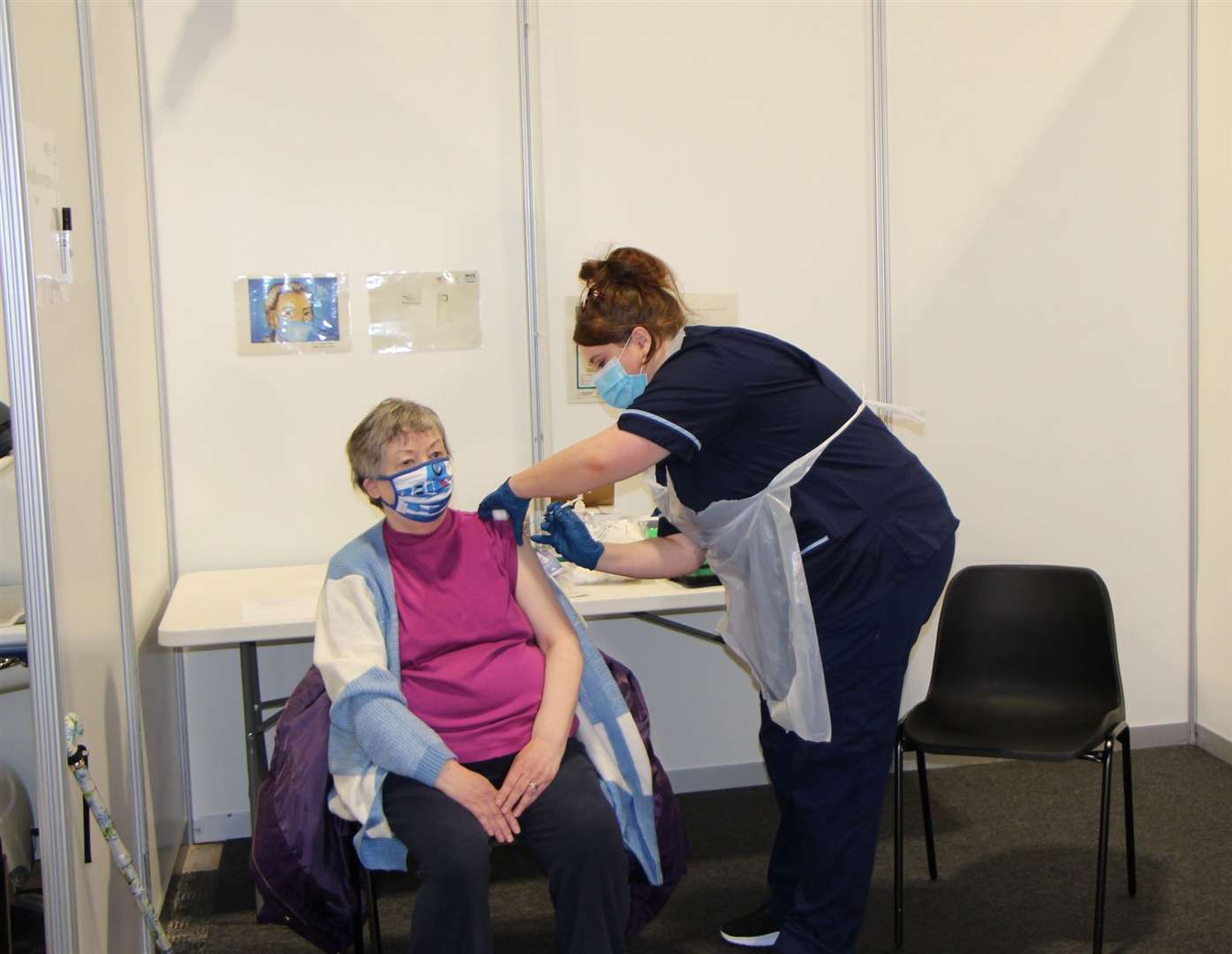 Violet Adams receives her first dose from Chloe England (NHS Grampian/PA)