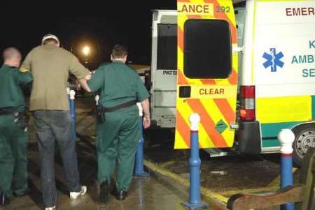 HURT BUT SAFE: The rescued man is escorted to a waiting ambulance. Picture courtesy RNLI WHITSTABLE